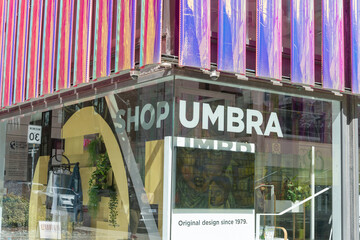 Fototapeta premium exterior building and sign of Umbra Store, a home goods store, located at 165 John Street in Toronto, Canada