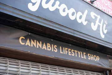 Fototapeta premium exterior building and sign of Hollywood Hi, a cannabis lifestyle shop, located at 241 Queen Street West in Toronto, Canada