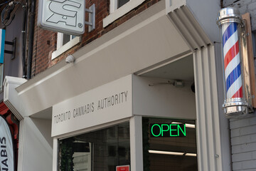 Fototapeta premium exterior building facade and sign of Toronto Cannabis Authority, a cannabis store, located at 229 Queen Street West