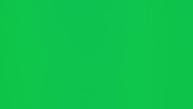 Male hand touching, clicking, tapping, sliding and swiping on chroma key green screen background. Different signs and gestures with fingers. Vertical video.