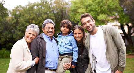 Portrait, smile and big family together in nature at garden for bonding, relationship or love at backyard. Face, park or child with parents, grandparents and happy mother with father for care outdoor