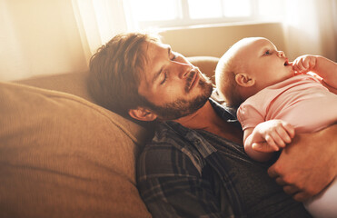 Tired, morning and father with baby on sofa for bonding, care and relax for parenting. Family, home...