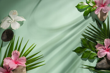 Composition made of meadow flowers and leaves on green background. Flat lay. View from above