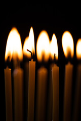 Burning candles on a black background
