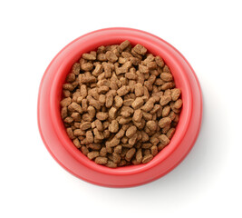 Dry pet food in red plastic bowl