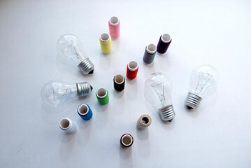 Spools of thread and light bulbs	