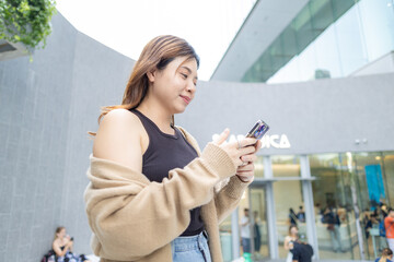 Business asian woman casual use smartphone city building communication happy enjoy business woman