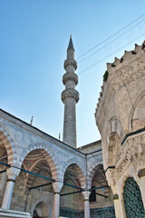 Fototapeta na wymiar ISTANBUL, TURKEY - MARCH 23, 2024: Courtyard of the New Mosque known also as Yeni Cami in Istanbul, Turkey