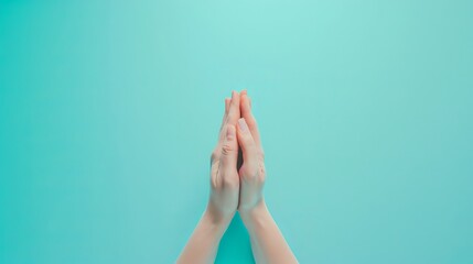Individual Demonstrating Prayer Hands Posture Against Monochrome Backdrop