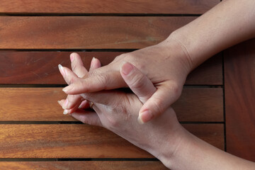 Holding both hands on table