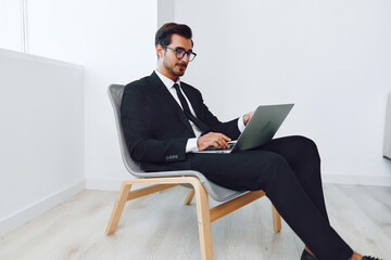 Man office technology laptop chair winner happy business