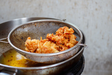 fried chicken skin on pan, thai street food.