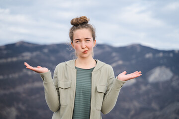 Uncertain young woman with confused face in expressing doubts and bewilderment, girl looking at...