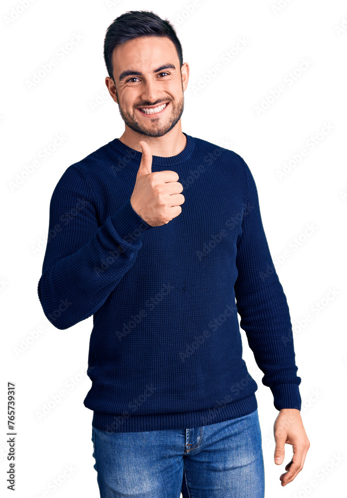 Canvas Prints young handsome man wearing casual clothes doing happy thumbs up gesture with hand. approving express