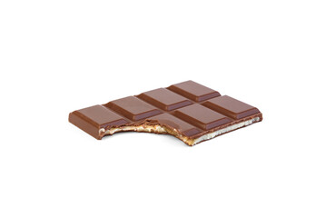 Milk chocolate with milk filling and caramel isolated on white background.