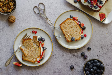 walnut cake with figs, pomegranate seeds and blueberries