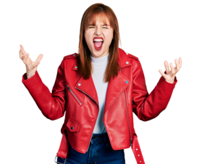 Redhead young woman wearing red leather jacket crazy and mad shouting and yelling with aggressive expression and arms raised. frustration concept.
