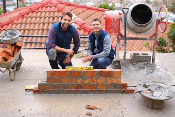 Construction, bricklayer and men building a brick wall, handyman or contractor with trade, mentor...