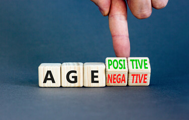 Age positivity or negativity symbol. Concept word Age positivity or Age negativity. Beautiful grey background. Psychologist hand. Psychological age positivity or negativity concept. Copy space.