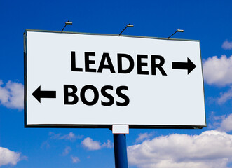 Leader or boss symbol. Concept word Leader or Boss on beautiful billboard with two arrows. Beautiful blue sky with clouds background. Business and leader or boss concept. Copy space.