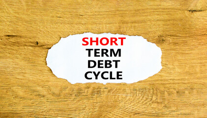 Short term debt cycle symbol. Concept words Short term debt cycle on beautiful white paper. Beautiful wooden background. Business Short term debt cycle concept. Copy space