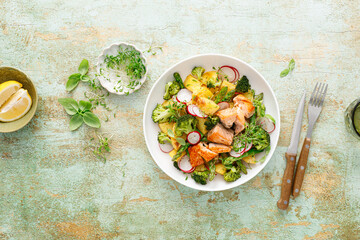 Salmon and potato salad with asparagus, broccoli and radish, top view - obrazy, fototapety, plakaty