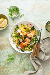 Fotobehang Salmon and potato salad with asparagus, broccoli and radish, top view © Sea Wave