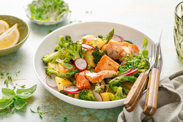 Salmon and potato salad with asparagus, broccoli and radish