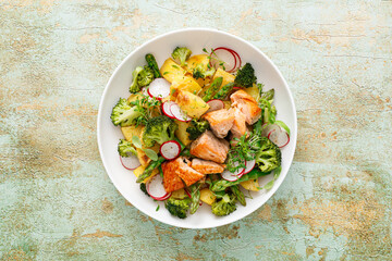 Salmon and potato salad with asparagus, broccoli and radish, top view - 765750377