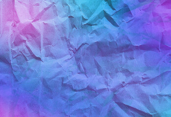 close up texture of gradient neon purple, blue, pink crumpled or torn craft paper use as background with blank space for design. abstract creased recycle neon paper texture for futuristic concept.