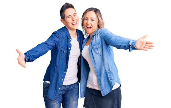 Couple of women wearing casual clothes looking at the camera smiling with open arms for hug. cheerful expression embracing happiness.