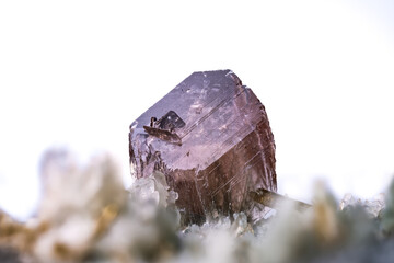 axinite crystal photography from Saint-Christophe-en-Oisans, Grenoble, France. isolated on white...