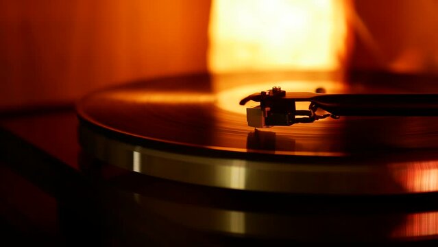 A Retro-Styled Spinning Record Vinyl Player. The camera moves slowly from left to right
