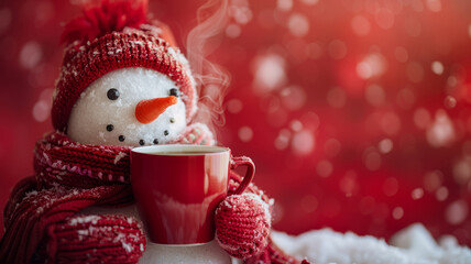Snowman with red mug and knitwear.