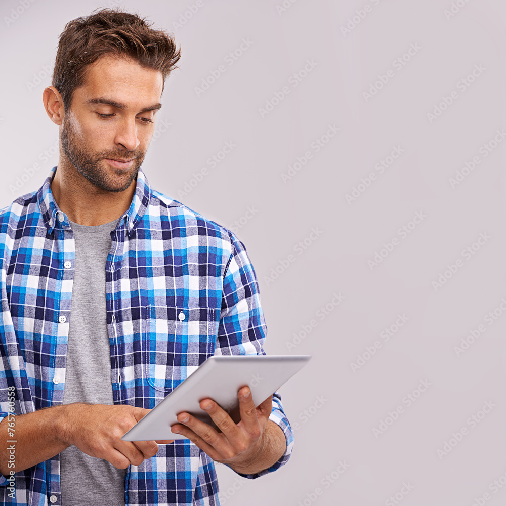 Poster Typing, tablet and man with connection, internet and digital app on a grey studio background. Person, mockup space and model with technology or communication with social media and website information