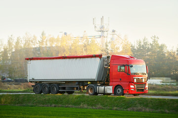 Semi-trucks on the highway. They are part of a complex logistics network.