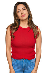 Obraz premium Young hispanic woman wearing casual clothes relaxed with serious expression on face. simple and natural looking at the camera.