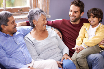 Grandparents, father and child on sofa in home for bonding, relationship and relax together. Big...