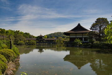 Fototapeta na wymiar A covered bridge over the pond. Kyoto Japan 