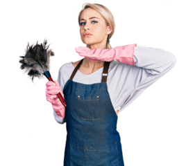 Beautiful young blonde woman wearing apron holding cleaning duster cutting throat with hand as knife, threaten aggression with furious violence