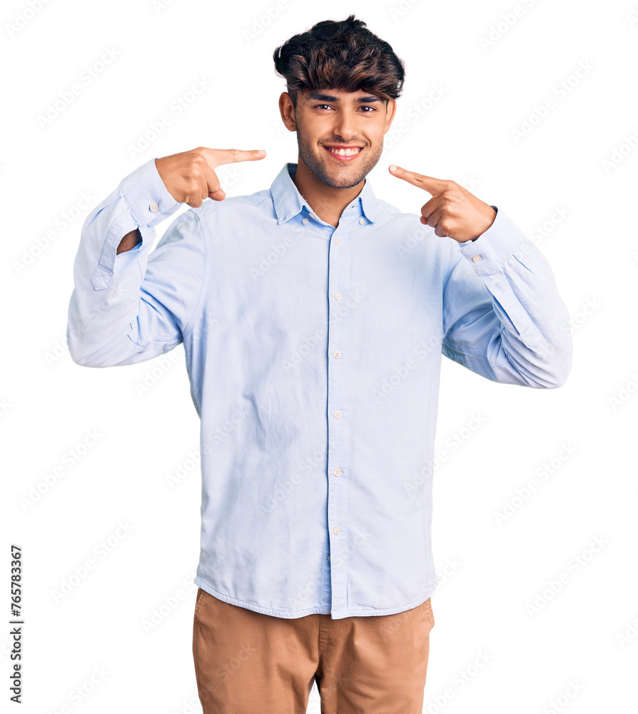 Poster Young hispanic man wearing casual shirt smiling cheerful showing and pointing with fingers teeth and mouth. dental health concept.