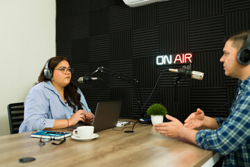 Latin people in the recording studio for a talk show podcast