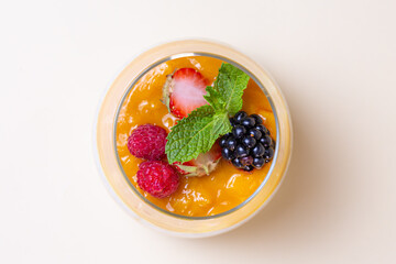 Top view Chia seed pudding with fresh berries and mint