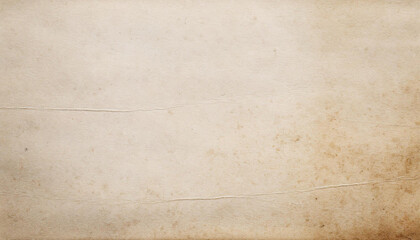 Textured, old vintage paper with a warm tone and speckled surface, perfect for backgrounds or overlays.