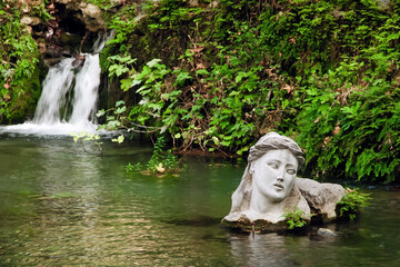 River Erkyna, the one of two rivers of feminine name in Greece, in the city of Livadeia, Central Greece. The bust personifies goddess Erkyna.