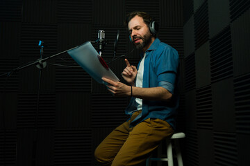 Voice actor recording audio in studio