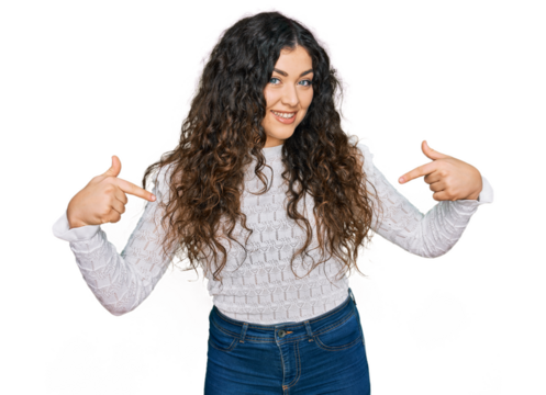 Young hispanic girl wearing casual clothes looking confident with smile on face, pointing oneself with fingers proud and happy.