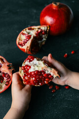 Pomegranate on Phantom Blue background. Top view, close up, background
