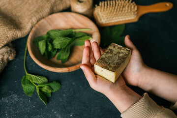 Natural solid shampoo with mint in hands