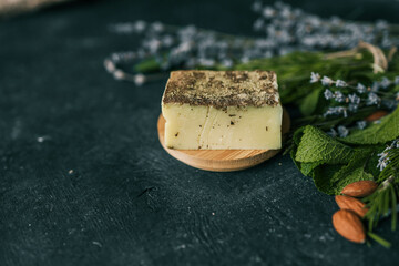 Natural soap with a collection of herbs: rosemary, lavender, mint